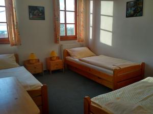 Postel nebo postele na pokoji v ubytování Penzion Bouquet