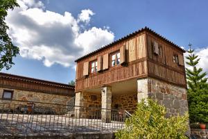 an old house with a tower on top of it at Solar da Salvadoura in Amares