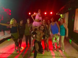 a group of people posing for a picture on a stage at Camping Europa Beach in Castellare-di-Casinca