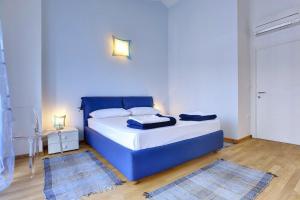 Ein Bett oder Betten in einem Zimmer der Unterkunft Holiday Home Baldini