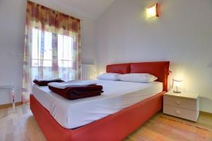 Ein Bett oder Betten in einem Zimmer der Unterkunft Holiday Home Baldini