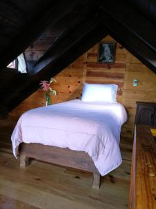 מיטה או מיטות בחדר ב-Hospedaje Herradura