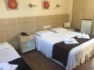 Postel nebo postele na pokoji v ubytování Palace Hotel