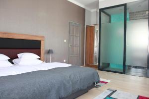 Posteľ alebo postele v izbe v ubytovaní Portré Apartman