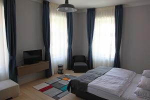Posteľ alebo postele v izbe v ubytovaní Portré Apartman