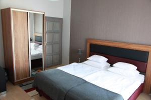 Posteľ alebo postele v izbe v ubytovaní Portré Apartman