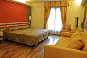 Postel nebo postele na pokoji v ubytování Hotel Baita Clementi