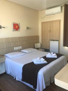 Postel nebo postele na pokoji v ubytování Palace Hotel