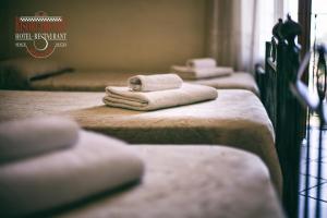 Postel nebo postele na pokoji v ubytování Hotel Risorgimento