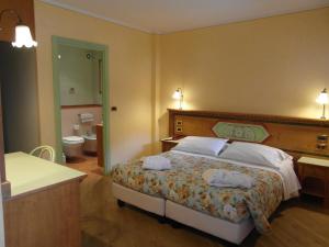 Postel nebo postele na pokoji v ubytování Hotel Ideal