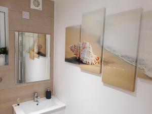 a bathroom with a sink and a mirror at Royal Mile Apartment in Edinburgh +58 photos
