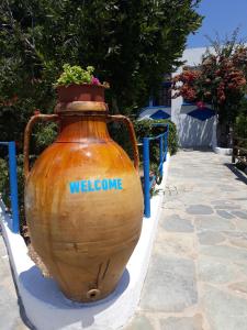 a large vase with the word welcome on it at Paradise Studios in Leipsoi