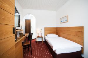 Postel nebo postele na pokoji v ubytování Hotel.Pension.Golingen