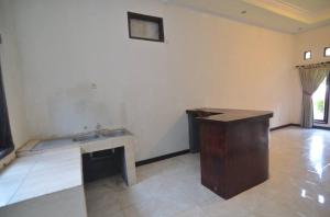 Postel nebo postele na pokoji v ubytování Puri Itoma Bungalows