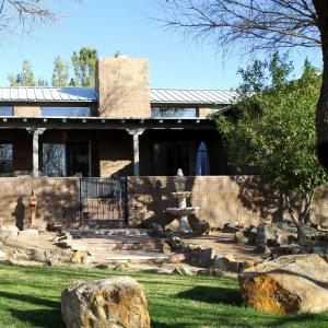 a house with a fountain in front of a yard at Amado Territory B&B in Amado