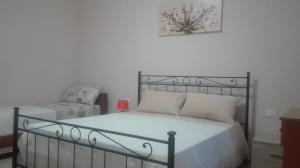 A bed or beds in a room at Agriturismo Serra Vecchia