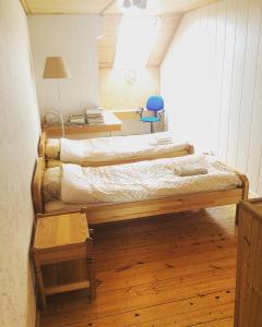 a bedroom with two beds in a room at Jolando Apartment in Kaunas