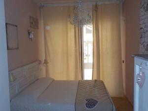 Posteľ alebo postele v izbe v ubytovaní Loft a pochi passi dal mare
