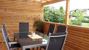 a table and chairs sitting on a patio at Fewo-Barbara-Rust in Rust