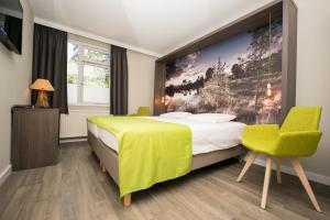 Postel nebo postele na pokoji v ubytování Hotel de Hoeve van Nunspeet