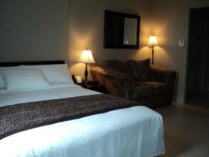 Postel nebo postele na pokoji v ubytování Montecassino Hotel & Event Centre