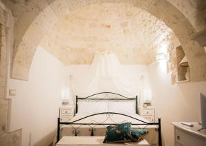 A bed or beds in a room at Il Carpino Még 37 kép