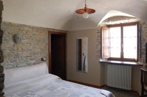 Posteľ alebo postele v izbe v ubytovaní Appartamenti Cenni - Relais su Lago