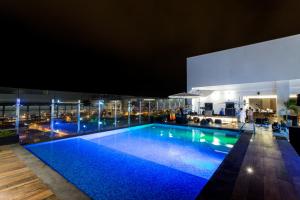 a pool on the roof of a building at night at Wyndham Costa del Sol Tumbes in Tumbes