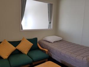 Een bed of bedden in een kamer bij Manhattan Motel