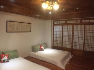 Una cama o camas en una habitación de Yuan Gong Yuan
