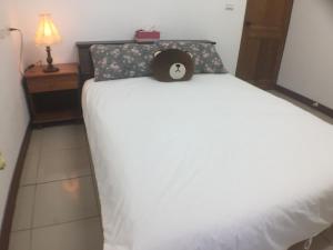 Una cama o camas en una habitación de Yuan Gong Yuan