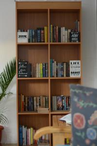 a book shelf filled with lots of books at Amor's Place in Puerto Princesa City