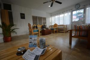 a living room with a table and a dining room at Amor's Place in Puerto Princesa City