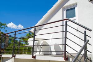 a metal railing on a balcony of a house at Split Center in Split