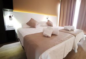 Ein Bett oder Betten in einem Zimmer der Unterkunft Planet Hotels ONE - Adults Only 16 years