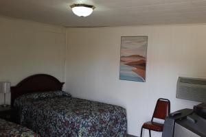 Ένα ή περισσότερα κρεβάτια σε δωμάτιο στο The Inn