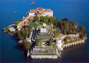 an island in the water with a building on it at Residenza Pesce D'Oro in Verbania