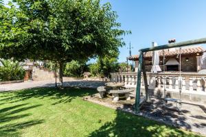 a park with a picnic table and a tree at Villa Marina in Playa de Palma in Palma de Mallorca