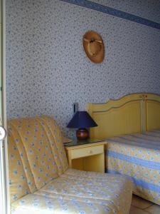 Łóżko lub łóżka w pokoju w obiekcie L'Hacienda