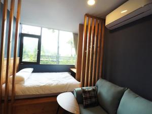 Кровать или кровати в номере Yue Lake Backpackers