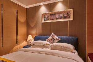 Heefun International Apartment - Zhujiang New Town FuLi Brand New World Plaza客房内的一张或多张床位