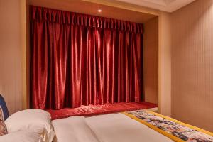 Heefun International Apartment - Zhujiang New Town FuLi Brand New World Plaza客房内的一张或多张床位