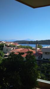 a view of the water from the roof of a building at Nikolitsa Apartments in Glyfada Fokidas