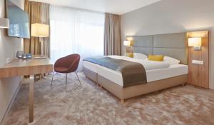 Postel nebo postele na pokoji v ubytování Upstalsboom Parkhotel