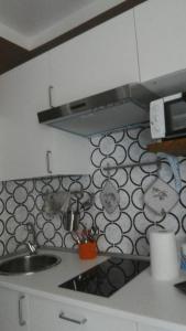 a kitchen with a sink and a counter top at Camere In Centro in Agropoli