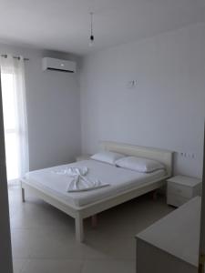 מיטה או מיטות בחדר ב-Residence Kullat