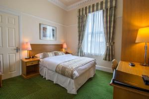 Ένα ή περισσότερα κρεβάτια σε δωμάτιο στο A Park View Hotel