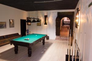 a billiard room with a pool table in it at Vinalia - Conacul din Ceptura in Ceptura de Jos
