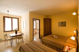 Ένα ή περισσότερα κρεβάτια σε δωμάτιο στο Agriturismo Cascina Roveri