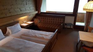 En eller flere senge i et værelse på Gasthof Hotel IFENBLICK
